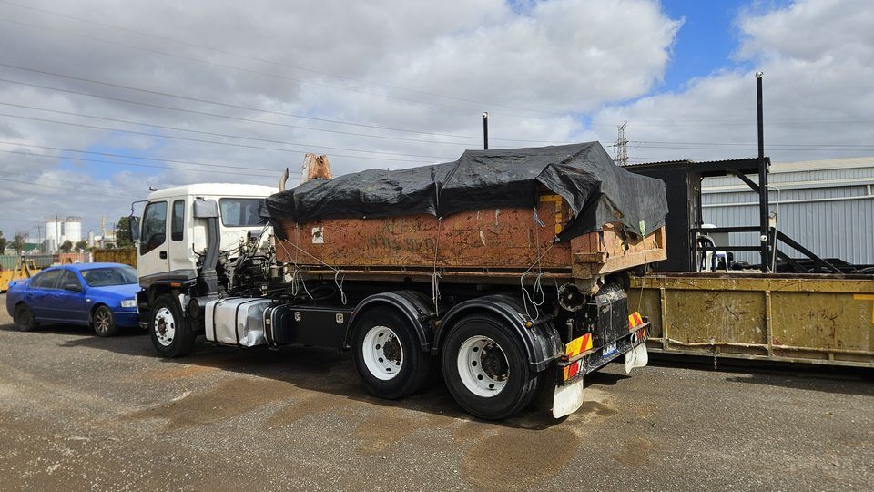 Hook lift skip bin truck rear view — Apex Bins Brooklyn depot